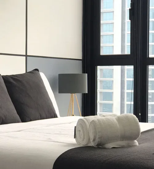 Hotel bed with fresh towels