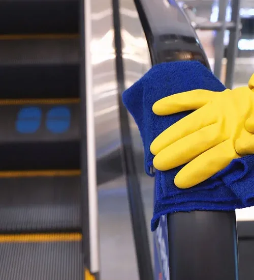 Wiping a handrail in a store